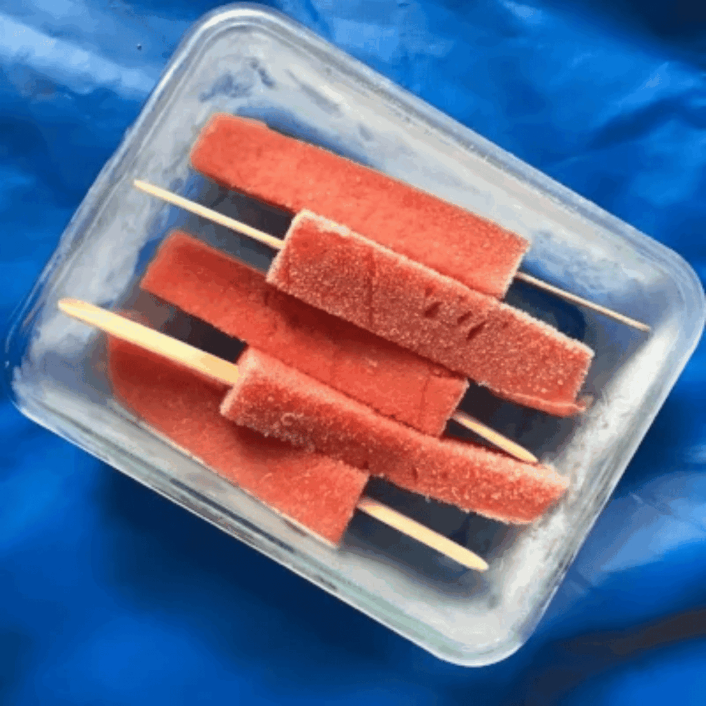 Frozen watermelon on a stick.