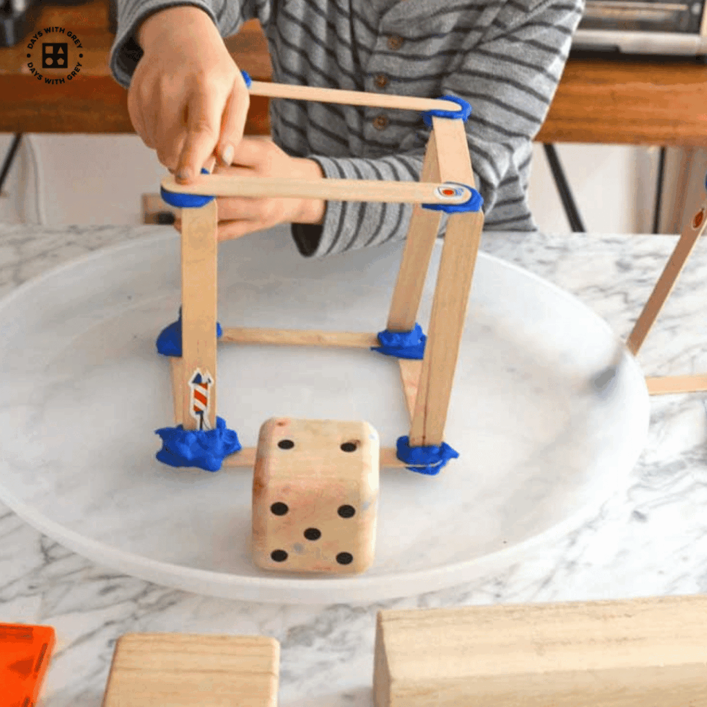 Kindergartener building a 3D shape.
