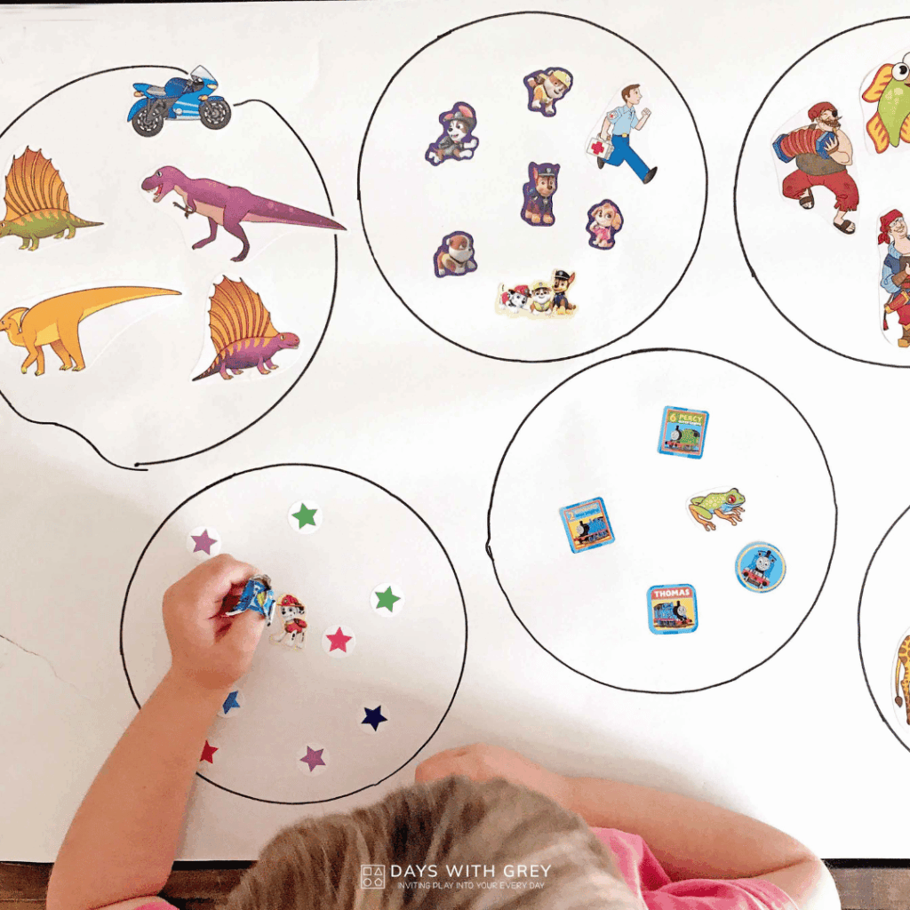 A five year old looking at stickers.